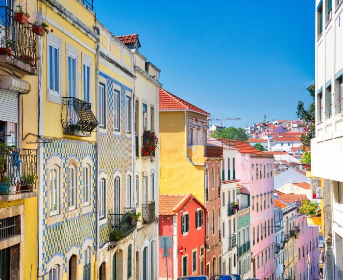 Colorful buildings of Lisbon historic center near landmark Rossio Square