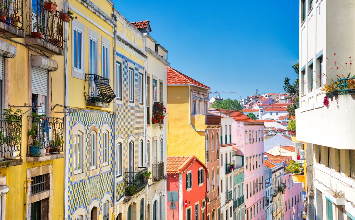 Colorful buildings of Lisbon historic center near landmark Rossio Square