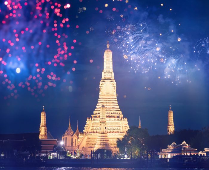 Wat Arun temple in bangkok with fireworks. New year and holiday concept.