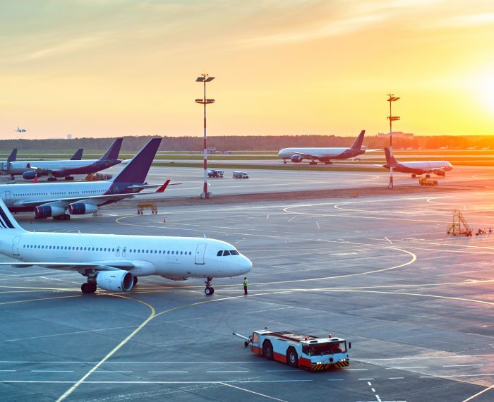 Modern airport at sunset